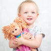 Baby Girl Holding A Rag Doll