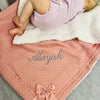 baby lay on personalised rose gold baby blanket