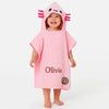 Child wearing a pink hooded towel with cartoon character design and name 'Olivia' on a white background