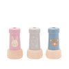 Three Bambino Wooden Kaleidoscopes 3 designs made from FSC wood, featuring pastel-colored bodies and natural wood bases. From left to right: a pink kaleidoscope with a bunny illustration, a gray kaleidoscope with star and moon illustrations, and a blue kaleidoscope with a bear illustration. Perfect for nursery decoration. From New Bambino Draft.