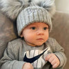 Personalised GBaby boy wearing a Personalised Grey Pom Pom Hat