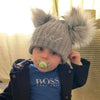 Baby boy wearing a Personalised Grey Pom Pom Hat