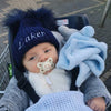 baby boy wearing a Personalised Navy Pom Pom Hat 