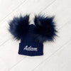 baby boy wearing a Personalised Navy Pom Pom Hat 