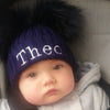 baby boy wearing a Personalised Navy Pom Pom Hat 
