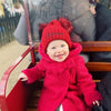 Baby Girl wearing a Personalised Red Double Pom Hat 