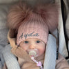 baby girl wearing a Personalised Rose Gold Pom Pom Hat