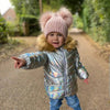 baby girl wearing a Personalised Rose Gold Pom Pom Hat