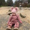 baby girl wearing a Personalised Rose Gold Pom Pom Hat