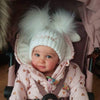 Baby wearing a Personalised White Double Pom Hat