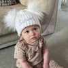 Baby wearing a Personalised White Double Pom Hat